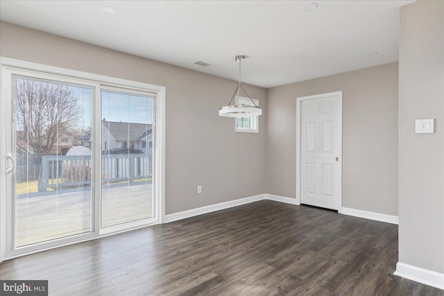 unfurnished dining area featuring dark hardwood / wood-style floors