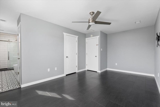 unfurnished bedroom featuring ceiling fan and ensuite bath