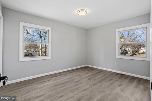 empty room featuring hardwood / wood-style floors