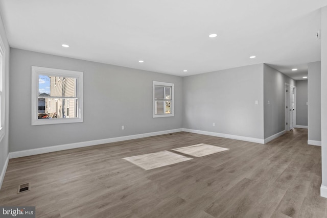 unfurnished room with light hardwood / wood-style flooring