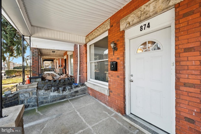 entrance to property featuring a porch