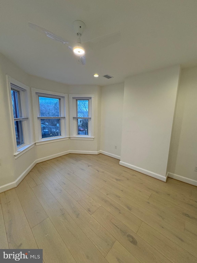 unfurnished room featuring light hardwood / wood-style flooring