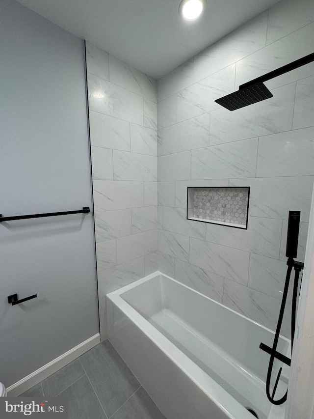 bathroom with tile patterned flooring and tiled shower / bath combo