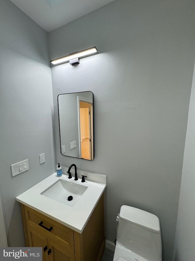 bathroom with vanity and toilet