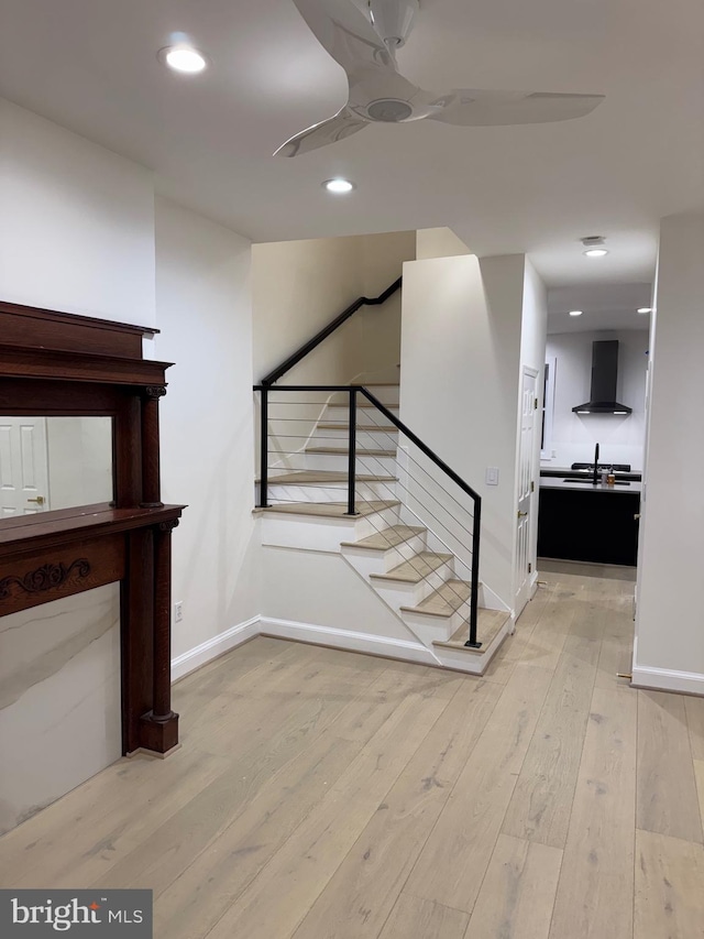 stairs featuring hardwood / wood-style floors