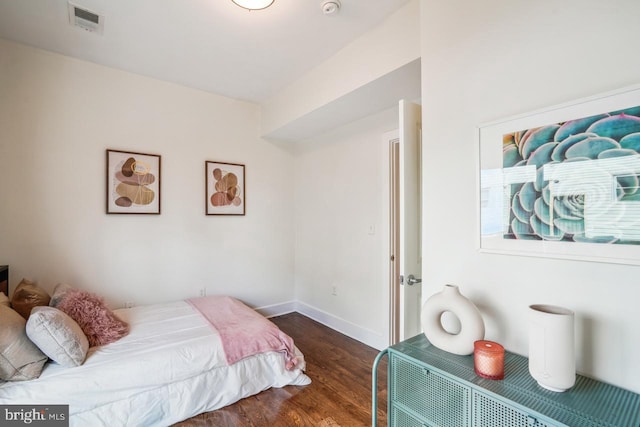 bedroom featuring dark hardwood / wood-style floors