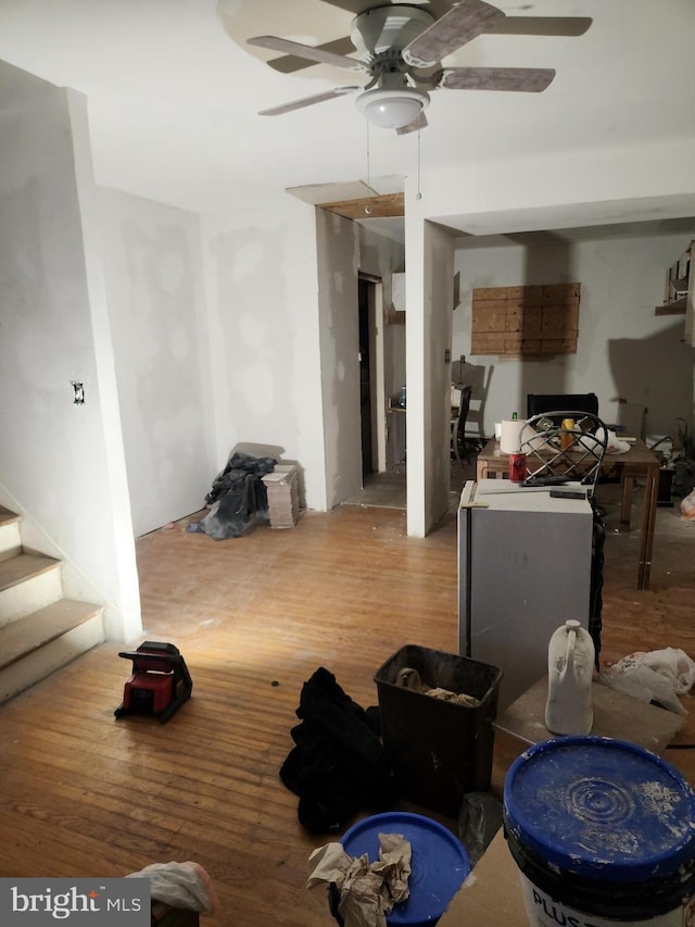 interior space featuring ceiling fan and hardwood / wood-style flooring