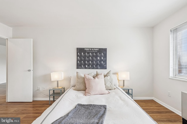 bedroom with wood-type flooring