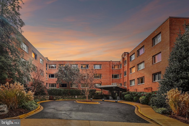 view of outdoor building at dusk