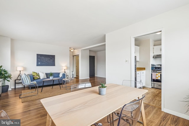 dining area with wood-type flooring