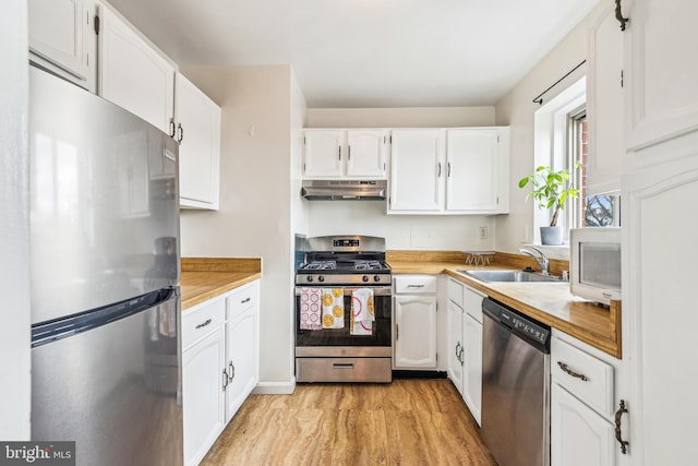 kitchen with white cabinetry, sink, and appliances with stainless steel finishes