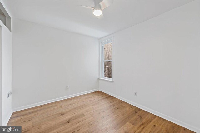 unfurnished room featuring light hardwood / wood-style floors and ceiling fan