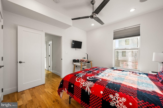 bedroom featuring light hardwood / wood-style floors and ceiling fan