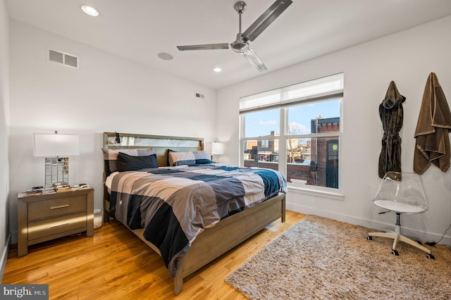 bedroom with ceiling fan and light hardwood / wood-style floors