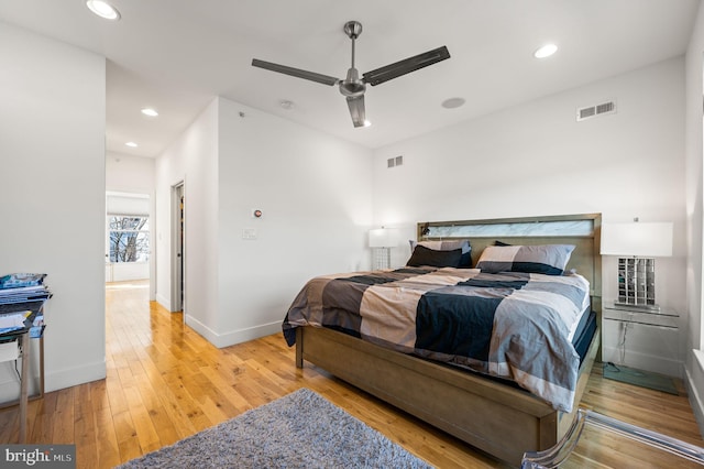 bedroom featuring light hardwood / wood-style floors and ceiling fan