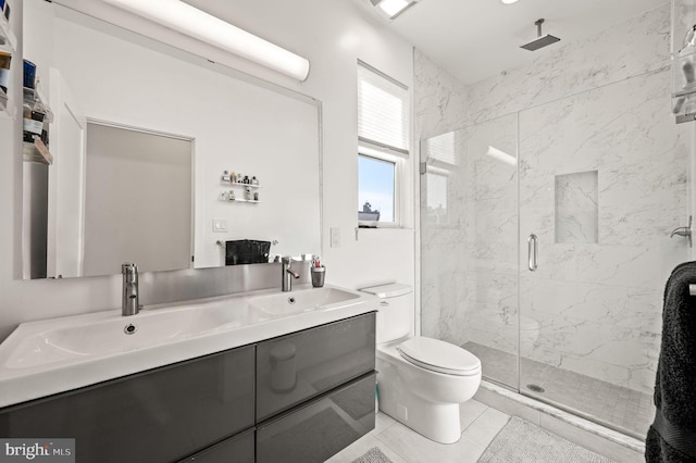 bathroom featuring toilet, tile patterned flooring, vanity, and walk in shower