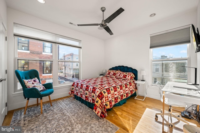 bedroom featuring hardwood / wood-style floors and ceiling fan