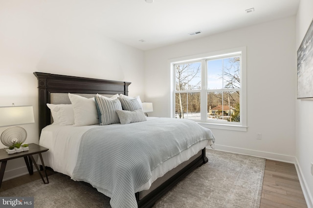 bedroom featuring hardwood / wood-style flooring