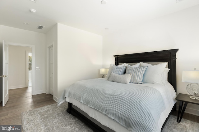 bedroom featuring hardwood / wood-style flooring