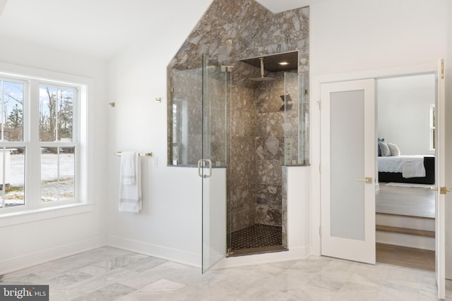 bathroom featuring french doors and an enclosed shower