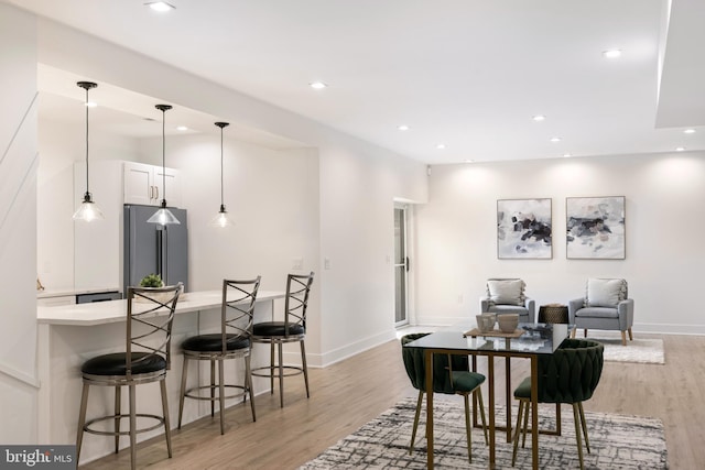 dining area with light wood-type flooring