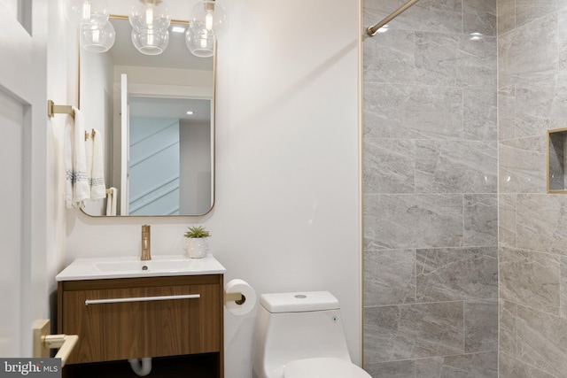 bathroom featuring vanity and toilet