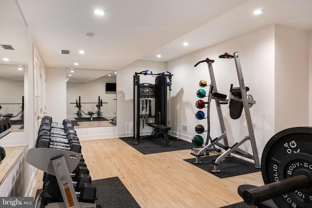 workout room with hardwood / wood-style flooring