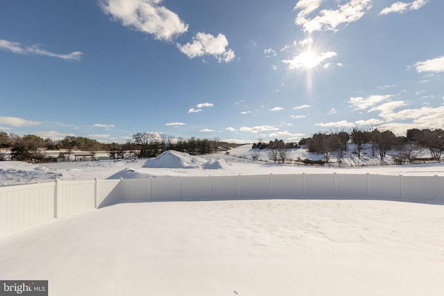 view of yard covered in snow