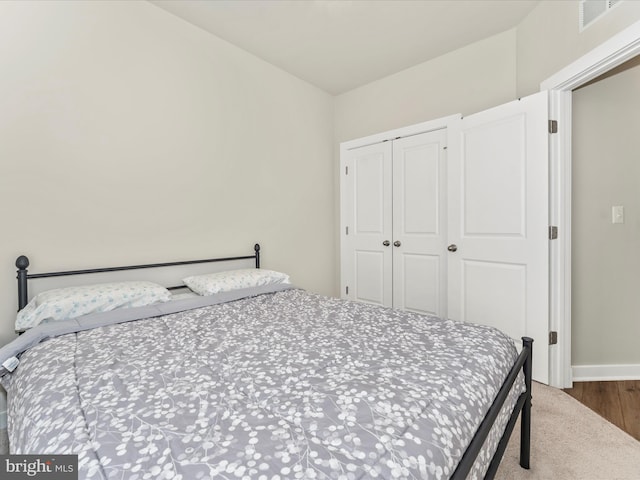 bedroom featuring a closet and carpet