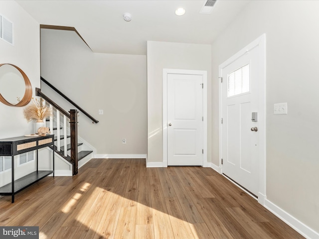 foyer with wood-type flooring