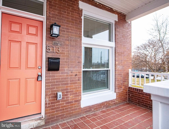 doorway to property with a porch