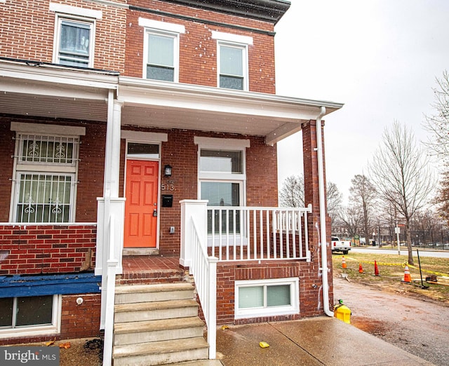 doorway to property featuring a porch