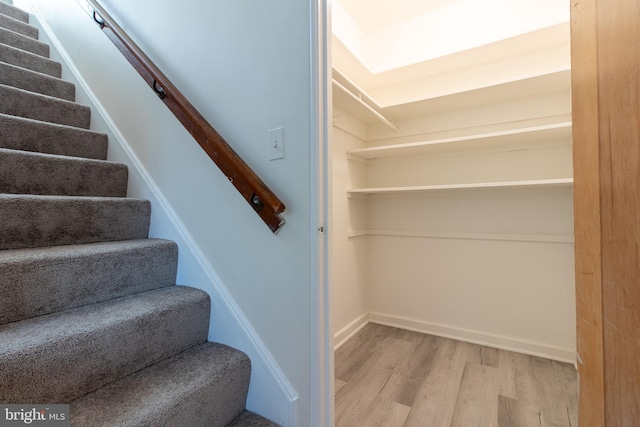 staircase featuring hardwood / wood-style flooring