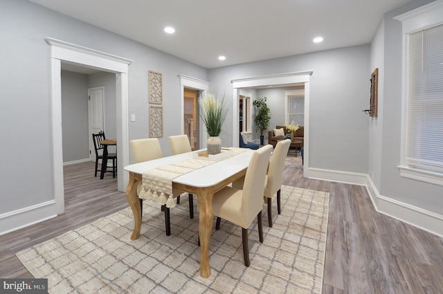 dining area featuring wood-type flooring