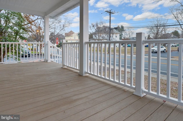 wooden deck featuring covered porch