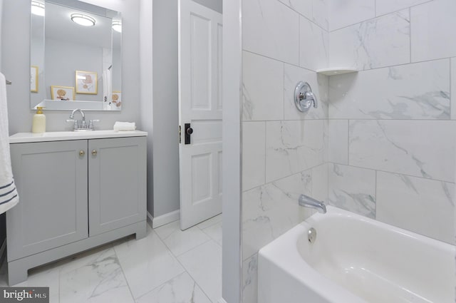 bathroom with vanity and tiled shower / bath combo