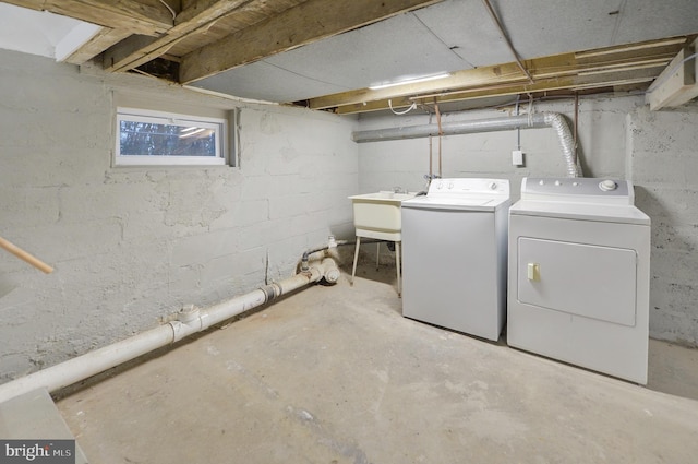 laundry area with washer and dryer and sink