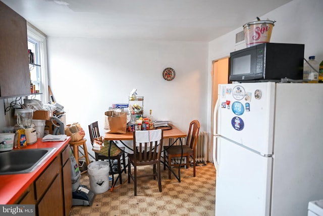 kitchen with white fridge and sink