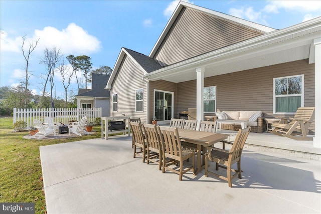 view of patio featuring an outdoor living space with a fire pit