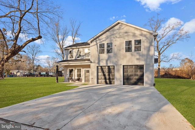 view of front of home featuring a porch, a garage, and a front lawn