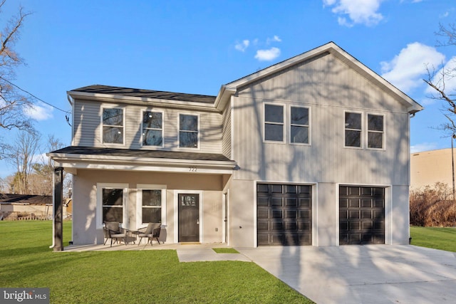 view of front of home with a garage and a front yard