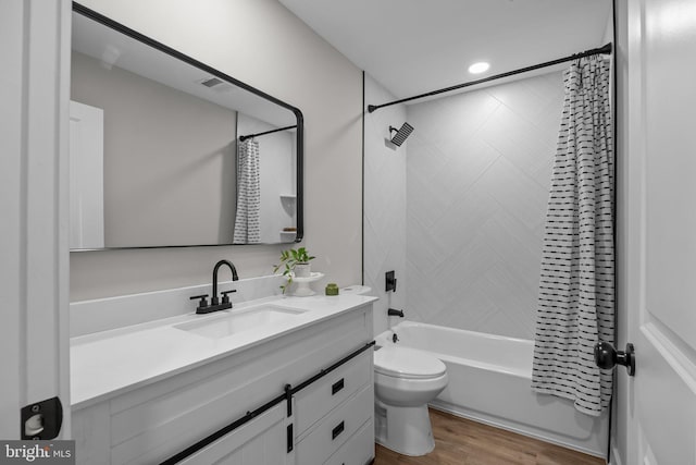 full bathroom with toilet, vanity, shower / tub combo, and hardwood / wood-style flooring