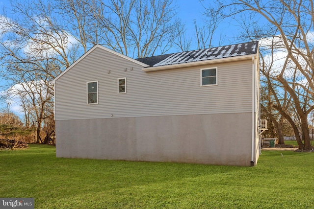 view of home's exterior featuring a yard