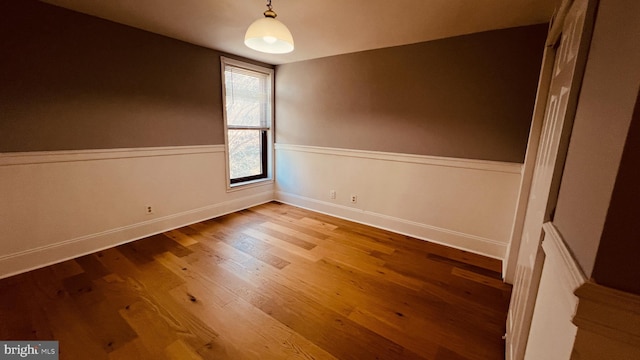 spare room featuring hardwood / wood-style floors