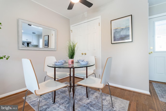 dining area featuring hardwood / wood-style flooring and ceiling fan