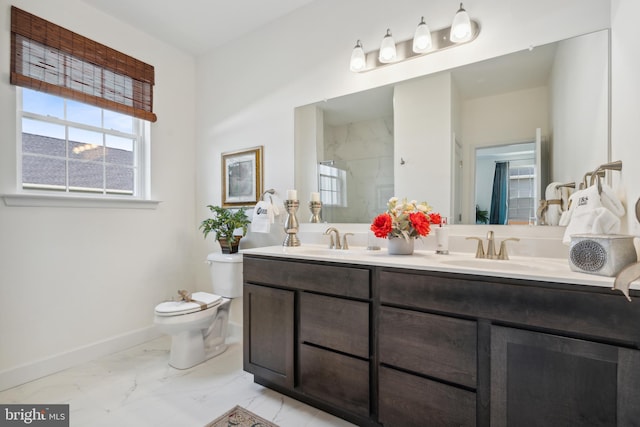 bathroom featuring vanity, toilet, and walk in shower