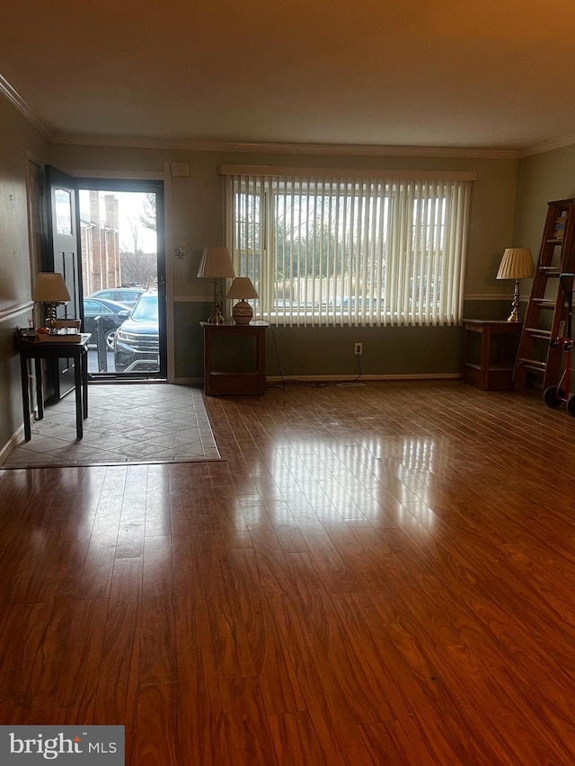 living room featuring wood-type flooring and ornamental molding