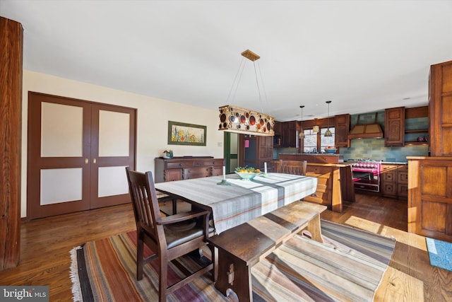 dining room with french doors and dark hardwood / wood-style flooring