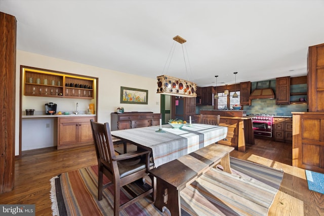 dining space featuring dark hardwood / wood-style floors