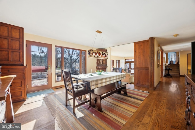 dining area with hardwood / wood-style flooring